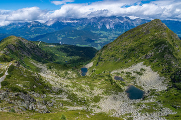 View from Rippeteck peak towards Hohe Dachstein in Austria with Spiegelsee in foreground