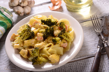 Pasta with broccoli and chicken with cheese sauce