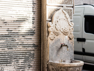 an antique traditional water fountain - side shoot