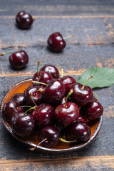 Giant fresh ripe black cherries, new harvest, ready to eat close up