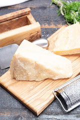 Traditional italian food - 36 months aged in caves Italian parmesan hard cheese from Parmigiano-Reggiano, Italy