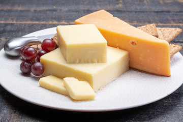 Aged English cheddar and old Dutch cheese, the most popular type of hard cheeses made from cow milk...