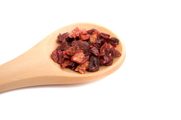 red paprika dried pepper in wooden spoon isolated on the white