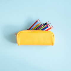 School accessories on soft blue background. Back to school concept. Creativity for kids. Colorful...