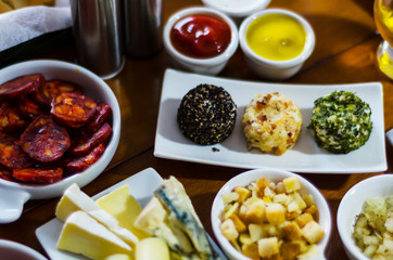 Set with different appetizers in small portions, healthy and delicious snacks