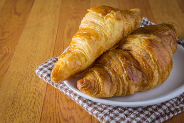 Croissant on wood table