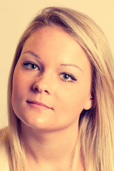 Obraz premium Faded Vintage Look Photo of Blonde Woman in the Studio