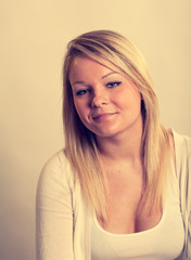 Faded Vintage Look Photo of Blonde Woman in the Studio