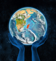 Madagascar on planet Earth in hands