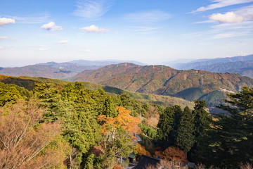 Naklejka premium Autumn landscape of japanese temple UNPENJI,mountains and transmission line towers,Kagawa,Tokushima,Shikoku,Japan