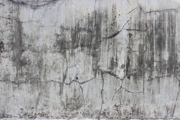 old cement concrete wall texture with unpolished surface, crack, and vertical stain scratches look because of weather effect