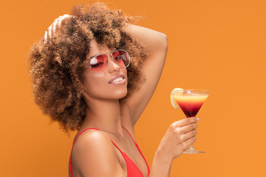 Afro Girl Having Fun With Colorful Drink.