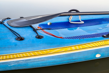 stand up paddleboard with paddle