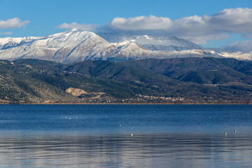 Amazing winter Landscape of Lake Pamvotida and Pindus mountain from city of Ioannina, Epirus, Greece