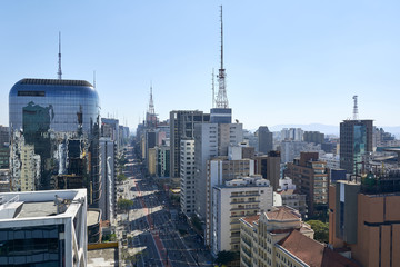 Fototapeta premium Paulista avenue in Sao Paulo. Aerial view of most famous avenue of Sao Paulo on national holiday morning on a sunny day. Important financial and business center of Brazil.