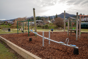 A modern playground with bark chips in a resort town