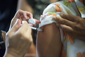 Doctors provide vaccinations to the public to help prevent influenza. Prevention concept