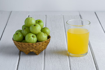 Indian gooseberry on wooden table