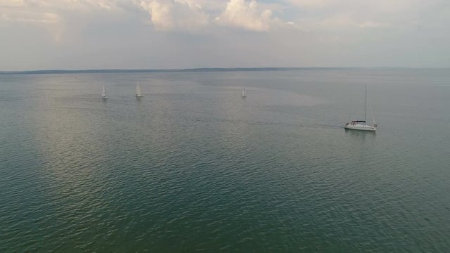 4K Aerial Footage. Regatta Yacht Sailing On River
