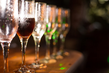 White wine pouring into glasses, close up view