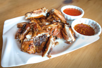 Chicken grill on white plate.