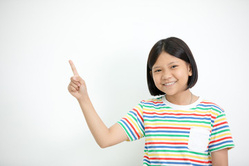Asian girl smiling and pointing finger up .