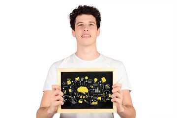 Young man holding a chalkboard with business sketch.