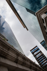 Low angle vertical view of corporate buildings in the financial district.