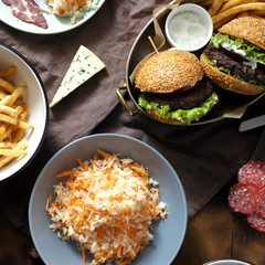 outdoor table burger french fries salad snacks Outdoors food
