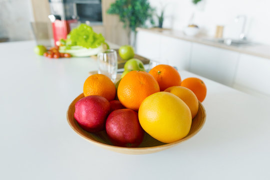 Full bowl fruit apples orange grapefruit home kitchen Healthy food