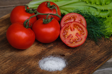 tomato vegetables on cutting Board