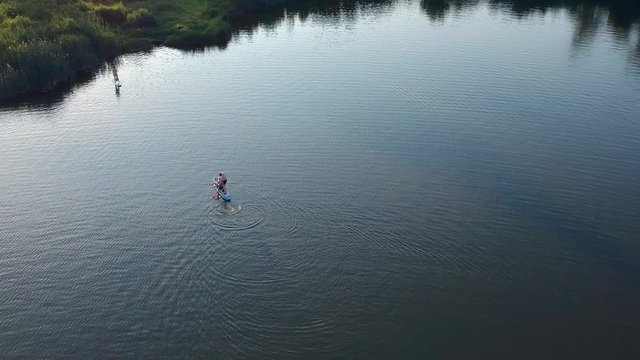 POLTAVA, UKRAINE - JUNE 18, 2016: people have a happy time in park near lake