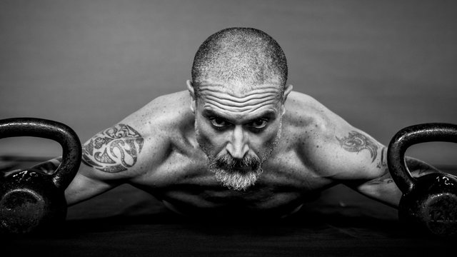 Close up of a 50 Y man doing physical exercise.