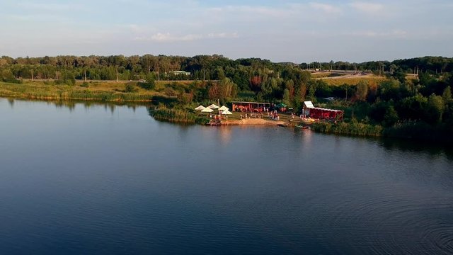 POLTAVA, UKRAINE - JUNE 18, 2016: people have a happy time in park near lake