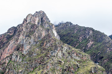 Andes rocky mountains peak with intense cloud formation on the background. Peru. South America. No people.