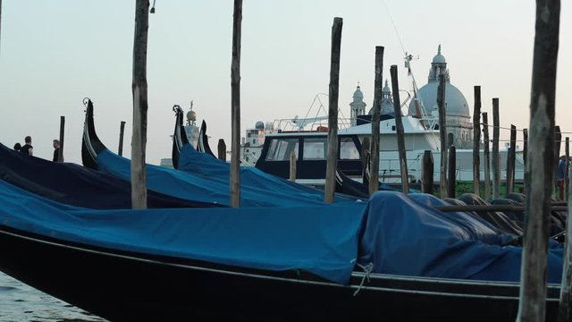 Gondolas floating at Pier in Venice at San Marco, Marcus Square. Recorded during Sun Set in 4K 60p with the Canon 1DX MII.