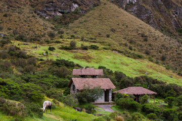 Fototapeta na wymiar Along the Inca Trail houses and Llama are seen in Andes panorama. Peru. South America. No people.