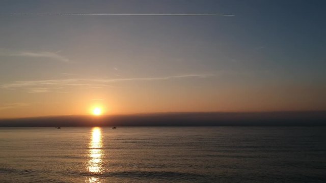 Beautiful sunrises and sunsets over the Mediterranean Sea near Marbella in Southern Spain, Andalucia. Clear skies and reflections at the start of a beautiful day.