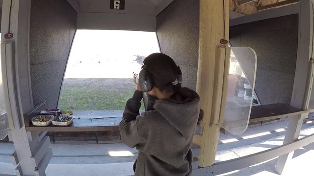 Female Shooting Rifle at Range