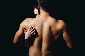 Loving his body. Woman hand touch man torso, rear view. Couple in love. He is absolutely mine. Back...