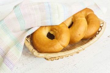 traditional bagels on a light wooden background