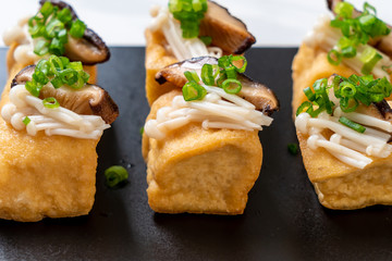 Fototapeta na wymiar Grilled Tofu with Shitake Mushroom and Golden Needle Mushroom