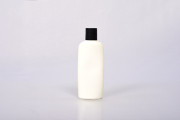 Plastic Blank White Bottle on grey background