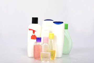Many white plastic bottles on white background.
