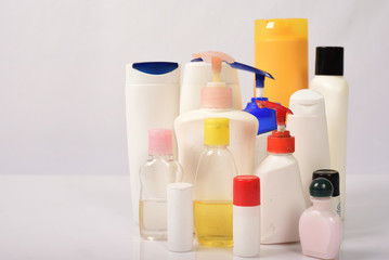 Many white plastic bottles on white background.