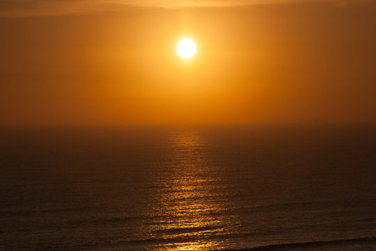 Beautiful blazing sunset above the ocean. Perfect background wallpaper image. No people. Lima. Peru. South America.