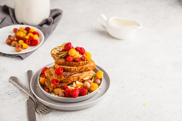 French toast with berries and syrup. Healthy vegan food concept.