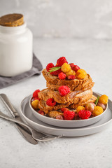French toast with berries and syrup, vertical. Healthy vegan food concept.