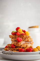 French toast with berries and syrup, vertical. Healthy vegan food concept.