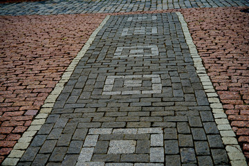 the floor is paved with cobblestones, outdoor